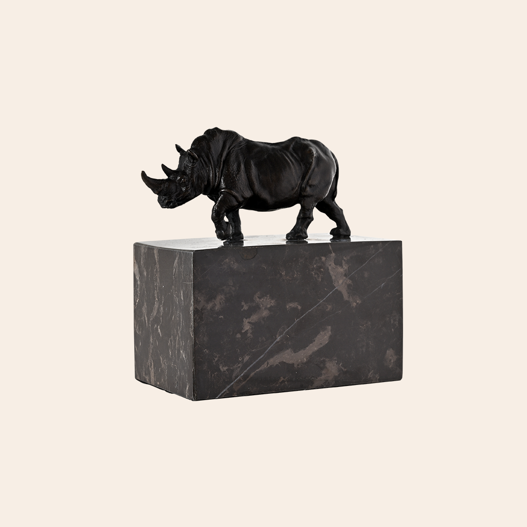 BRONZE RHINO ON GRANITE