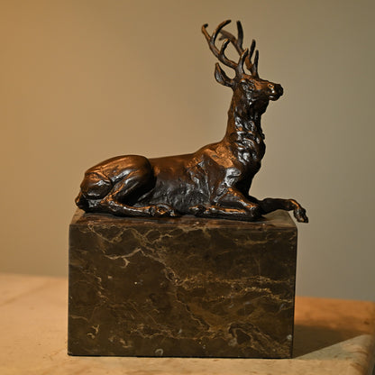 Bronze Sitting Deer Sculpture on Granite