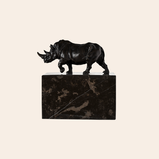 BRONZE RHINO ON GRANITE